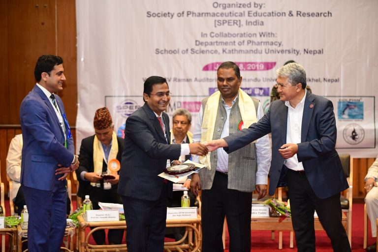Prof. Surya Prakash Gupta, Principal, Rajiv Gandhi Institute of Pharmacy, AKSU, receiving the “Principal of the Year-2019” Award from Sh. Upendra Yadav, the Deputy Prime Minister of Nepal.